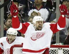 The Wings' Tomas Holmstrom celebrates after scoring during Detroit's 4-1 win over Columbus on Tuesday.(AP Photo/Paul Vernon)