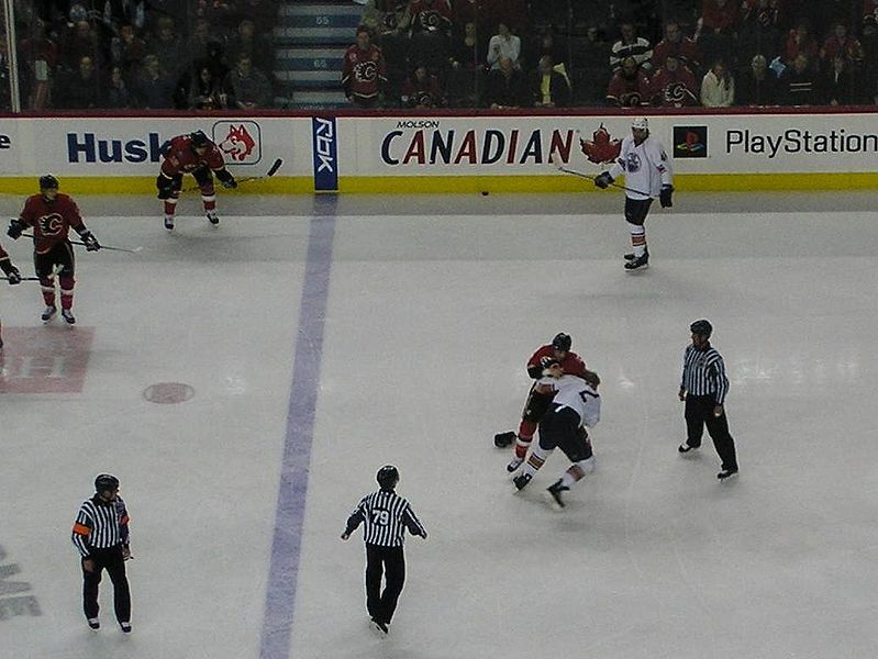Another round in the Battle of Alberta. Edmonton's Matt Greene vs. Calgary's Eric Godard. Courtesy of Resolute - Wikipedia Commons