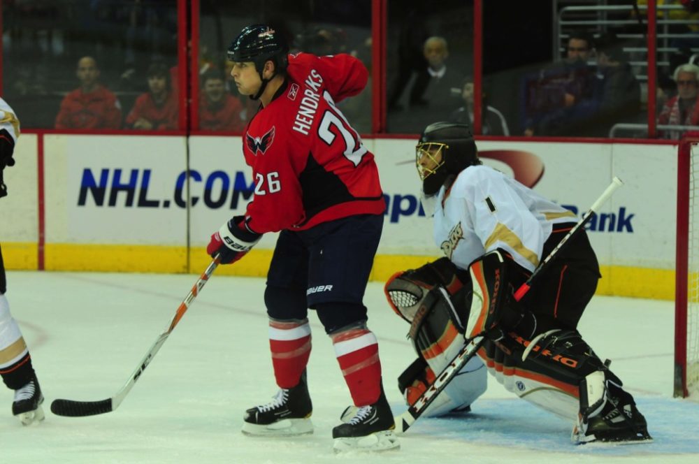 Matt Hendricks, stopped in front of Jonas Hiller