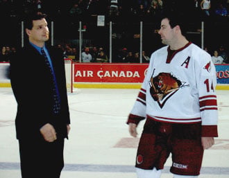 Eddie Olczyk (left) with Jon Sim at the last professional hockey game at the Winnipeg Arena.