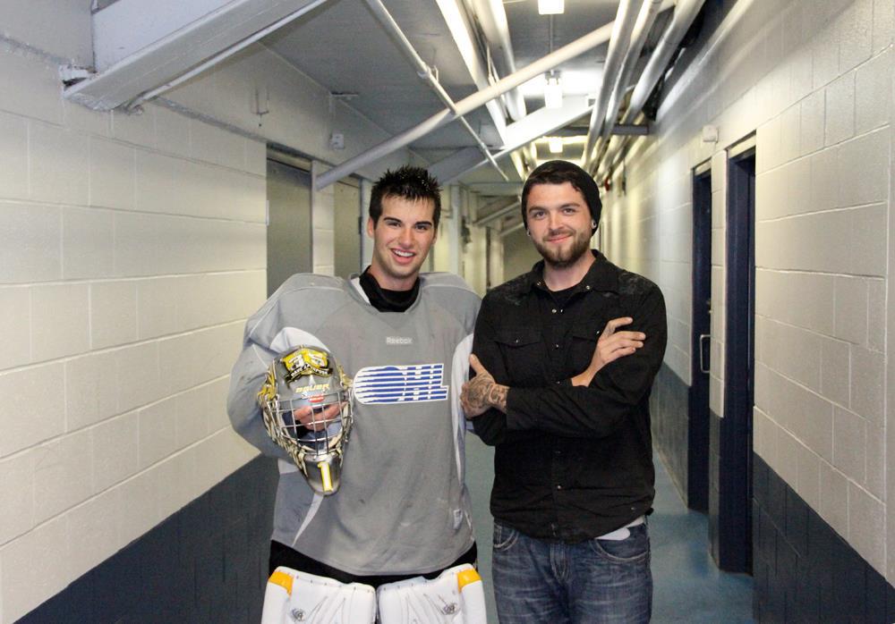 Manning (right) with Sarnia Sting goalie, Brandon Hope, showcasing his "HAP" goalie mask. [courtesy: Air Trix Studios]