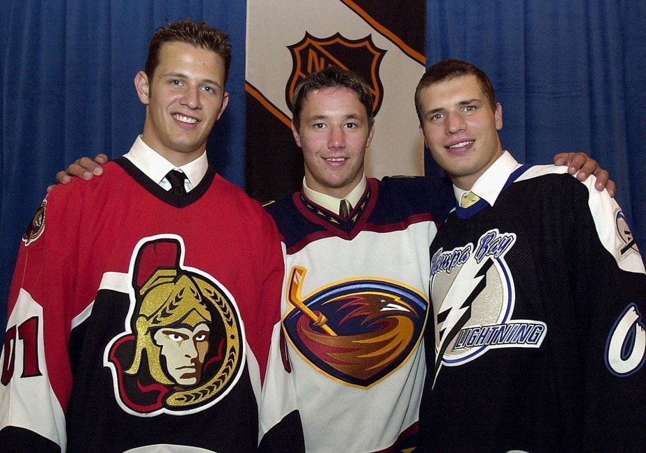 Jason Spezza, left, selected by the Ottawa Senators second overall, Ilya Kovalchuk selected by the Atlanta Thrashers first overall, and Alexander Svitov selected by the Tampa Bay Lightning
