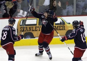 RJ Umberger, Christian Backman and Michael Peca celebrate an OT win over the San Jose Sharks Saturday at Nationwide Arena