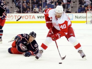 Henrik Zetterberg #40 of the Detroit Red Wings controls the puck in front of Antoine Vermette #50 of the Columbus Blue Jackets during Game Three of the Western Conference Quarterfinals. (Photo by Joe Sargent/Getty Images)