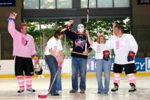 Matt "Jason" Garrett drops the ceremonial first puck between Alison Lukan (left) and Anna Cluxton (right)/Photo courtesy of Rachel Lewis
