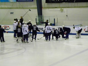 "Torts" goes over a play at practice (image property of the author)
