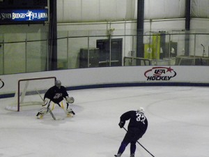 Ryan Miller takes on Dustin Byfuglien at Olympic Camp (photo property of author)