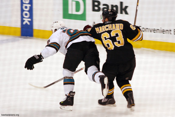 Brad Marchand tussling with an unknown San Jose player.