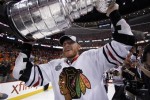 Marian Hossa, a key player that Dale Tallon signed in 2009, skating with Stanley Cup in 2010. (AP Photo/Matt Slocum)
