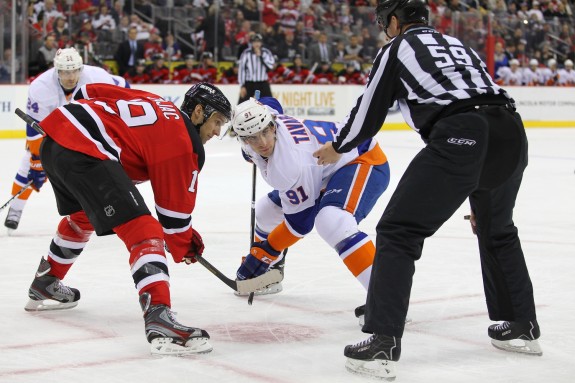 Travis Zajac gets set to battle John Tavares of the NY Islanders in the face-off circle. (Ed Mulholland-USA TODAY Sports)