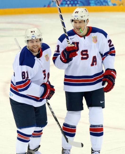 (Jayne Kamin-Oncea-USA TODAY Sports) Phil Kessel, left, seen here smiling after scoring a goal during the 2014 Olympics in Sochi, Russia, was inexplicably left on Team USA for the upcoming World Cup of Hockey in the fall.