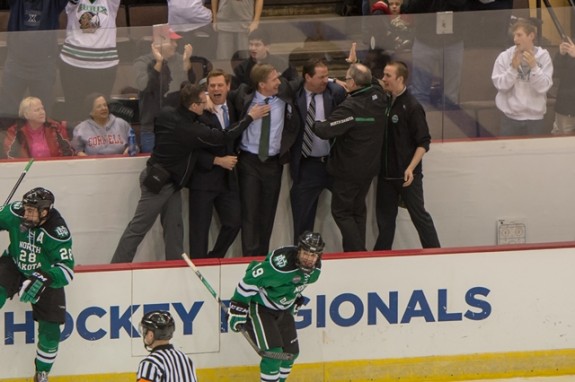 The UND coaching staff celebrates the Midwest Regional Win (Eric Classen /UND Athletics)