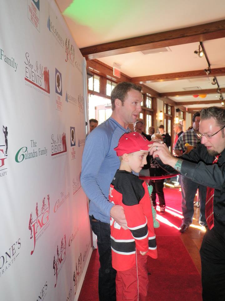Martin Brodeur poses with young Mat Kavchok at a benefit. (Photo by Alison Kavchok)