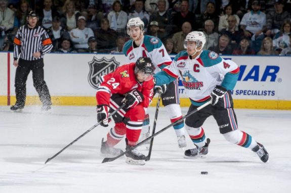 (Marissa Baecker/www.shootthebreeze.ca) Kelowna Rockets captain Madison Bowey, right, pokes the puck away from former Portland Winterhawks defenceman Mathew Dumba during the Western Conference final this past spring at Prospera Place in Kelowna. The Winterhawks won the third-round playoff series in five games before losing to the eventual Memorial Cup champion Edmonton Oil Kings in the WHL final. At left is former Rockets defenceman Damon Severson, who, like Dumba, is now starring in the NHL with the New Jersey Devils and Minnesota Wild, respectively, while Bowey is back in Kelowna as one of the WHL's premier blue-liners.