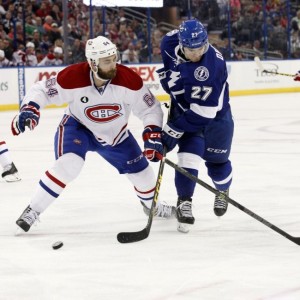 Montreal Canadiens defenseman Greg Pateryn and Tampa Bay Lightning forward Jonathan Drouin
