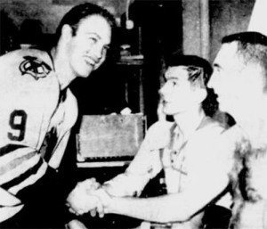 Bobby Hull congratulates Stan Mikita and Ken Wharram after their win at Detroit