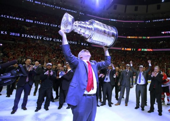 Joel Quenneville lifting Stanley Cup