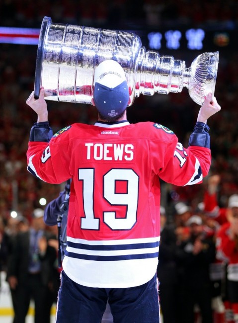 Jonathan Toews hoists the Stanley Cup for the third time six seasons. (Dennis Wierzbicki-USA TODAY Sports)