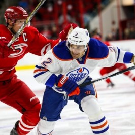 Edmonton Oilers defenseman Andrej Sekera (2) and Carolina Hurricanes center Eric Staal (12) during the NHL game between the Edmonton Oilers and the Carolina Hurricanes at the PNC Arena.