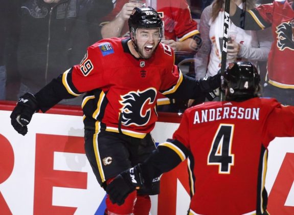Calgary Flames' Alan Quine and Rasmus Andersson