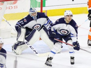 Connor Hellebuyck and Brandon Tanev - Winnipeg Jets vs Philadelphia Flyers - November 17, 2016 (Amy Irvin / The Hockey Writers)