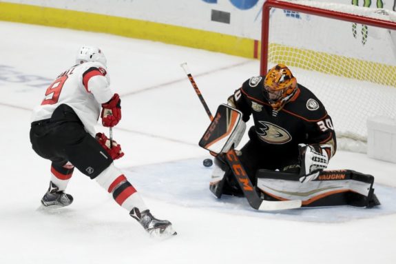 Anaheim Ducks Ryan Miller blocks a shot by New Jersey Devils Taylor Hall