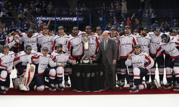 Washington Capitals players and coaches pose with the Prince of Wales Trophy