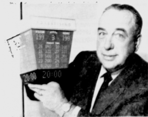 Canadiens' coach Toe Blake with a model of the Forum's new score clock.