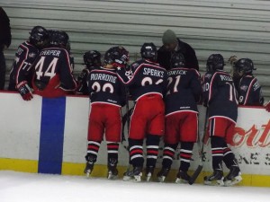 14U AAA Blue Jackets go over plays before a game. Photo Credit : Elaine Shircliff