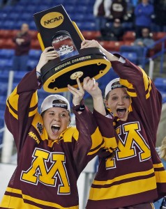 University of Minnesota co-captains Hannah Brandt and Lee Stecklein lift the National Championship trophy in 2016. Photo: Eric Miller/Gopher Athletics
