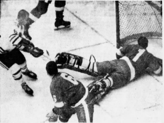 Memphis goalie George Gardner stretches to made a save on St. Louis forward Mike Chernoff (6) as Wings defenceman Doug Barrie watches.
