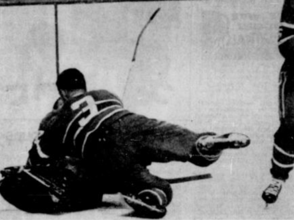 J.C. Tremblay and Gump Worsley do their best to cover a loose puck Saturday night in Montreal.